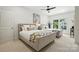 This bedroom offers two beds, a ceiling fan, and a bright and airy atmosphere at 21319 Baltic Dr, Cornelius, NC 28031