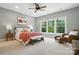 Bedroom with large windows bringing in lots of natural light, bench and chair at 21319 Baltic Dr, Cornelius, NC 28031
