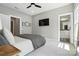 This bedroom boasts neutral paint, plush carpet, TV and ensuite bathroom at 21319 Baltic Dr, Cornelius, NC 28031