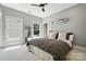 Bedroom features two windows, a large mirror, and contemporary decor at 21319 Baltic Dr, Cornelius, NC 28031