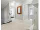 Upstairs hallway with white carpet, dark wood railing, and architectural detailing at 21319 Baltic Dr, Cornelius, NC 28031
