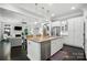 Gourmet kitchen with granite countertops, white cabinets, and stainless steel appliances at 21319 Baltic Dr, Cornelius, NC 28031