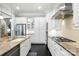 Gourmet kitchen boasts stainless appliances, white cabinets, and sleek modern design at 21319 Baltic Dr, Cornelius, NC 28031