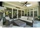 Covered porch with outdoor seating, fan, fireplace, and recessed lighting at 21319 Baltic Dr, Cornelius, NC 28031