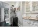 Cozy wet bar with wine fridge, shelving and a sink at 21319 Baltic Dr, Cornelius, NC 28031