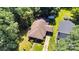 Aerial view of home surrounded by lush trees and a well-manicured lawn at 226 S Morrow Ave, Albemarle, NC 28001
