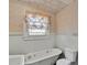 A bathroom featuring a clawfoot tub and vintage-style fixtures at 226 S Morrow Ave, Albemarle, NC 28001