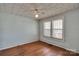 An empty bedroom with hardwood floors and good light at 226 S Morrow Ave, Albemarle, NC 28001