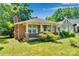 Charming brick home featuring a cozy front porch and classic architectural details at 226 S Morrow Ave, Albemarle, NC 28001