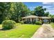 Charming brick home featuring a well-maintained lawn and inviting curb appeal at 226 S Morrow Ave, Albemarle, NC 28001
