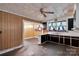 A kitchen with a ceiling fan and dark cabinets at 226 S Morrow Ave, Albemarle, NC 28001