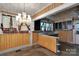Kitchen with wood-paneled walls and vintage fixtures at 226 S Morrow Ave, Albemarle, NC 28001