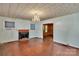 Spacious living room with fireplace, hardwood floors, and large windows at 226 S Morrow Ave, Albemarle, NC 28001