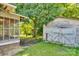Exterior view of a storage shed and a portion of the screened in back porch at 226 S Morrow Ave, Albemarle, NC 28001