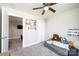 Neutral bedroom showcasing wall decor, ceiling fan, and a glimpse into an adjacent room at 2526 Snow Creek Ne Rd, Hickory, NC 28601