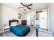 Comfortable bedroom featuring a ceiling fan, closet, and doorway to another room at 2526 Snow Creek Ne Rd, Hickory, NC 28601