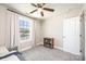 Cozy bedroom with a large window offering natural light and a small bookshelf at 2526 Snow Creek Ne Rd, Hickory, NC 28601