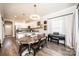 Cozy dining area adjacent to the kitchen features hardwood floors and natural light at 2526 Snow Creek Ne Rd, Hickory, NC 28601