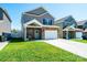 Traditional two-story home with stone accents, well-manicured lawn and ample parking at 2526 Snow Creek Ne Rd, Hickory, NC 28601