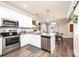 Bright kitchen featuring stainless appliances, granite countertops, and a view to the dining area at 2526 Snow Creek Ne Rd, Hickory, NC 28601