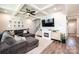 Comfortable living room featuring coffered ceilings, a fireplace, and hardwood floors at 2526 Snow Creek Ne Rd, Hickory, NC 28601