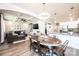 Open-concept living space with kitchen view, dining area, coffered ceiling, and hardwood floors at 2526 Snow Creek Ne Rd, Hickory, NC 28601