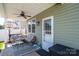 Relaxing covered patio with comfortable seating and stylish decor at 2526 Snow Creek Ne Rd, Hickory, NC 28601