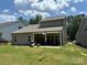 Large backyard with covered patio, perfect for entertaining or relaxing at 284 Old Harbor Dr, Mount Gilead, NC 27306