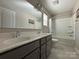 This spacious bathroom has double sinks, with a shower and tub combination at 284 Old Harbor Dr, Mount Gilead, NC 27306