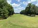 Expansive golf course featuring manicured greens, mature trees, and a picturesque landscape at 284 Old Harbor Dr, Mount Gilead, NC 27306