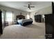 Large main bedroom with large windows and neutral colors at 284 Old Harbor Dr, Mount Gilead, NC 27306