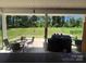Covered back patio with outdoor seating and backyard views at 284 Old Harbor Dr, Mount Gilead, NC 27306