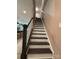 Staircase with views into the kitchen area at 284 Old Harbor Dr, Mount Gilead, NC 27306