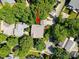 Overhead aerial shot of the house surrounded by lush trees in a residential neighborhood at 320 Magnolia St, Davidson, NC 28036
