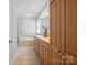 Bathroom featuring double sink vanity, large mirror, walk-in shower, and soaking tub at 320 Magnolia St, Davidson, NC 28036