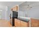 Kitchen featuring granite countertops, stainless steel appliances, and hardwood flooring at 320 Magnolia St, Davidson, NC 28036