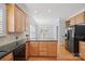 Kitchen with island, stainless appliances, granite countertops and tile backsplash at 320 Magnolia St, Davidson, NC 28036