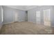 Spacious main bedroom with carpet flooring, trey ceilings, and ensuite bathroom entrance at 320 Magnolia St, Davidson, NC 28036