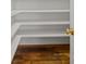 Walk in pantry with white shelves and hardwood floors at 320 Magnolia St, Davidson, NC 28036
