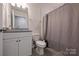 Functional bathroom with vanity, toilet, and shower, offering essential amenities and a clean, modern design at 336 Secretariat Dr, Iron Station, NC 28080