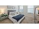 Comfortable bedroom with plush bedding, neutral tones, and natural light from windows for a relaxing atmosphere at 336 Secretariat Dr, Iron Station, NC 28080