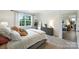 Cozy bedroom showcasing a comfortable bed, dresser, and natural light streaming through the large window at 336 Secretariat Dr, Iron Station, NC 28080