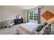 Inviting bedroom featuring a large window, neutral carpet, and a comfortable bed, creating a relaxing haven at 336 Secretariat Dr, Iron Station, NC 28080