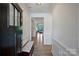 Bright entryway featuring hardwood floors, elegant molding, and a clear view into the living area at 336 Secretariat Dr, Iron Station, NC 28080