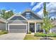 Charming home featuring a well-manicured lawn, covered entryway, and an attached two car garage at 336 Secretariat Dr, Iron Station, NC 28080