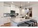 Modern kitchen featuring an island with granite countertops and stainless steel appliances at 336 Secretariat Dr, Iron Station, NC 28080