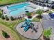 Aerial view of a playground area near pool with slides and other play equipment for children at 336 Secretariat Dr, Iron Station, NC 28080