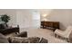 Sitting room featuring neutral carpet, a cabinet, and comfortable seating, creating a cozy and inviting space at 336 Secretariat Dr, Iron Station, NC 28080