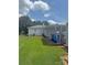 Exterior view of a backyard, home, and carport with trash receptacles at 3412 1St Avenue Nw Cir, Hickory, NC 28601