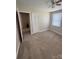 Bedroom features a large closet, neutral carpet, and bright window at 3412 1St Avenue Nw Cir, Hickory, NC 28601